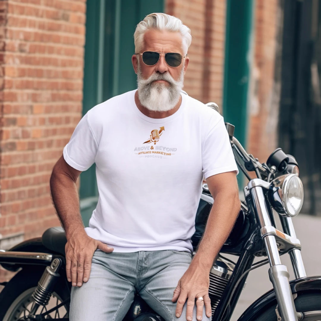 Man with a beard and sunglasses sitting on a motorcycle wearing a white t-shirt with a Above and Beyond Affiliate Marketing Podcast logo.